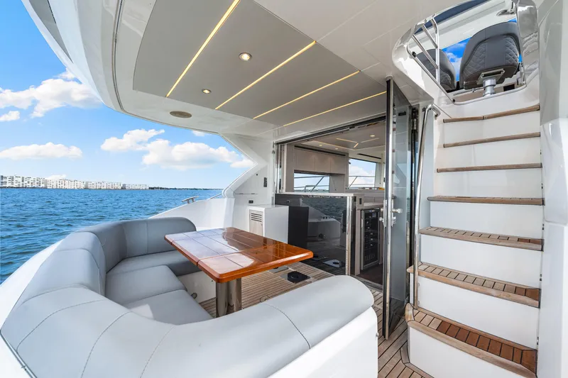 Slide: The Image of Luxurious Sunseeker Manhattan 55 yacht interior with seating and ocean view, 2021 model. - 32