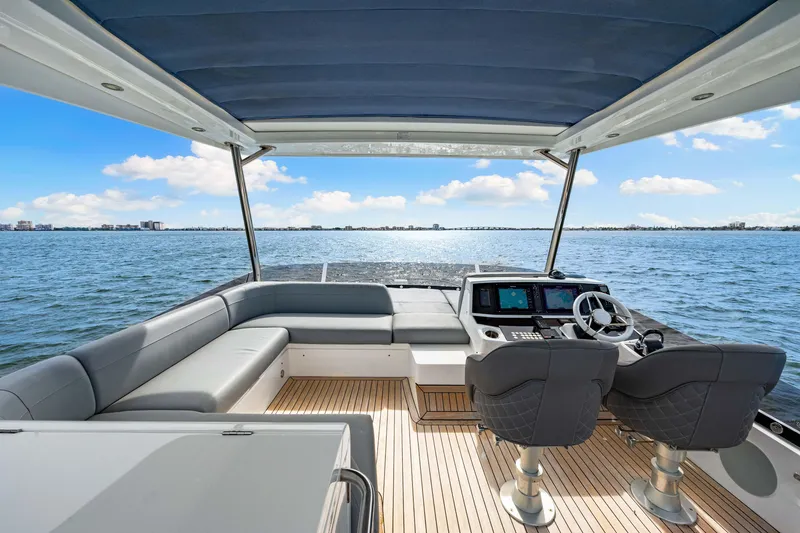 Slide: The Image of Luxurious 2021 Sunseeker Manhattan 55 yacht interior with ocean view and modern seating. - 42