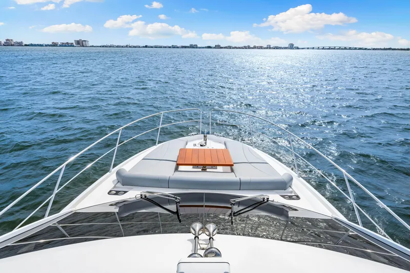 Slide: The Image of Sunseeker Manhattan 55 yacht cruising on open water, 2021 model. - 45