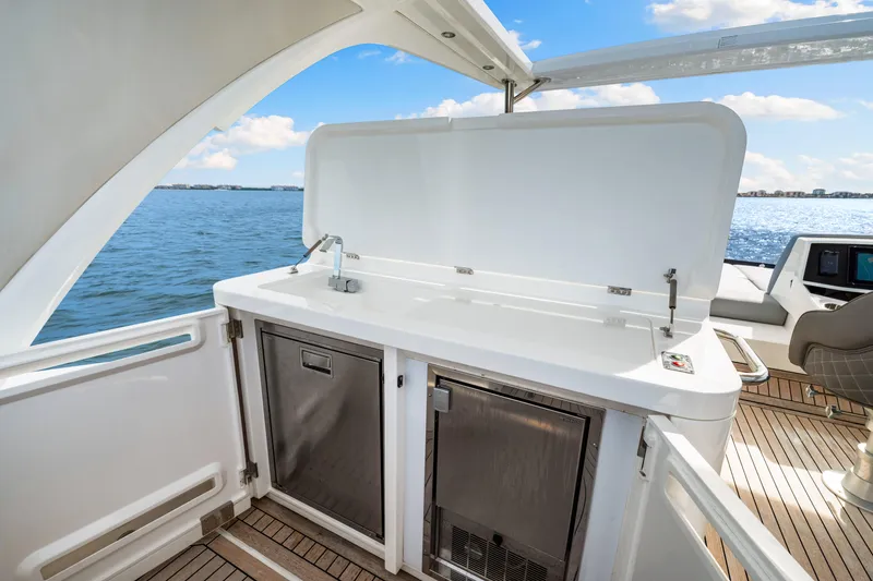 Slide: The Image of Luxurious Sunseeker Manhattan 55 yacht deck with outdoor kitchenette, 2021 model. - 47