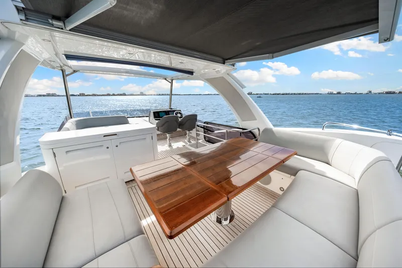 Slide: The Image of Luxurious 2021 Sunseeker Manhattan 55 yacht interior with elegant seating and ocean view. - 49
