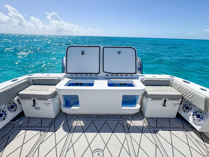 Slide: The Image of 2020 HCB 53 Sueños boat deck with ocean view, featuring storage and seating. - 8