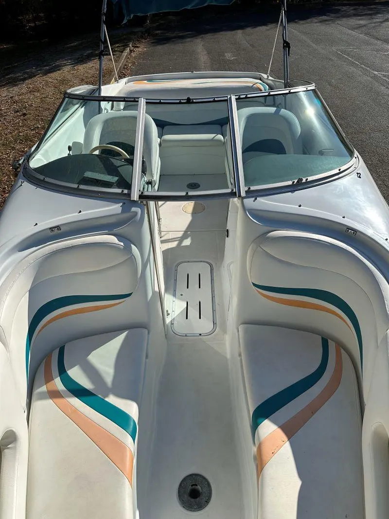 Slide: The Image of 1995 Baja 272 Islander boat with colorful interior design and dual seating. - 10