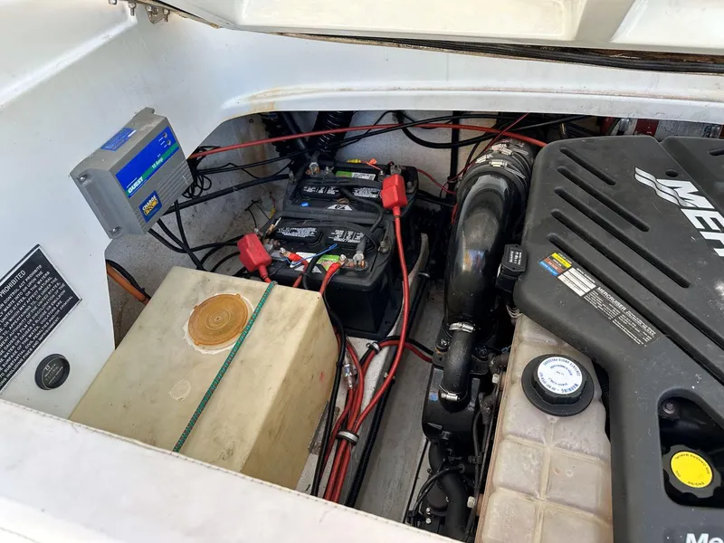 Slide: The Image of Engine compartment of a 1995 Baja 272 Islander boat, showing battery and wiring. - 12