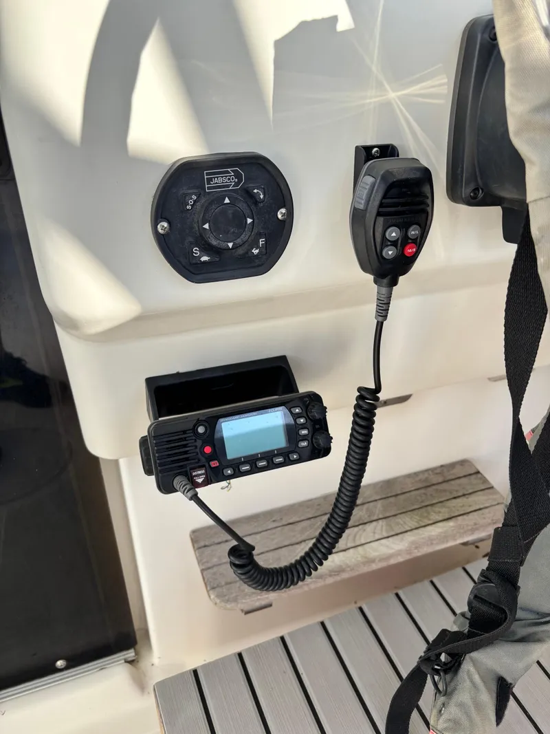 Slide: The Image of 1992 Pursuit 2800 Open boat control panel with radio and Jabsco switch. - 6