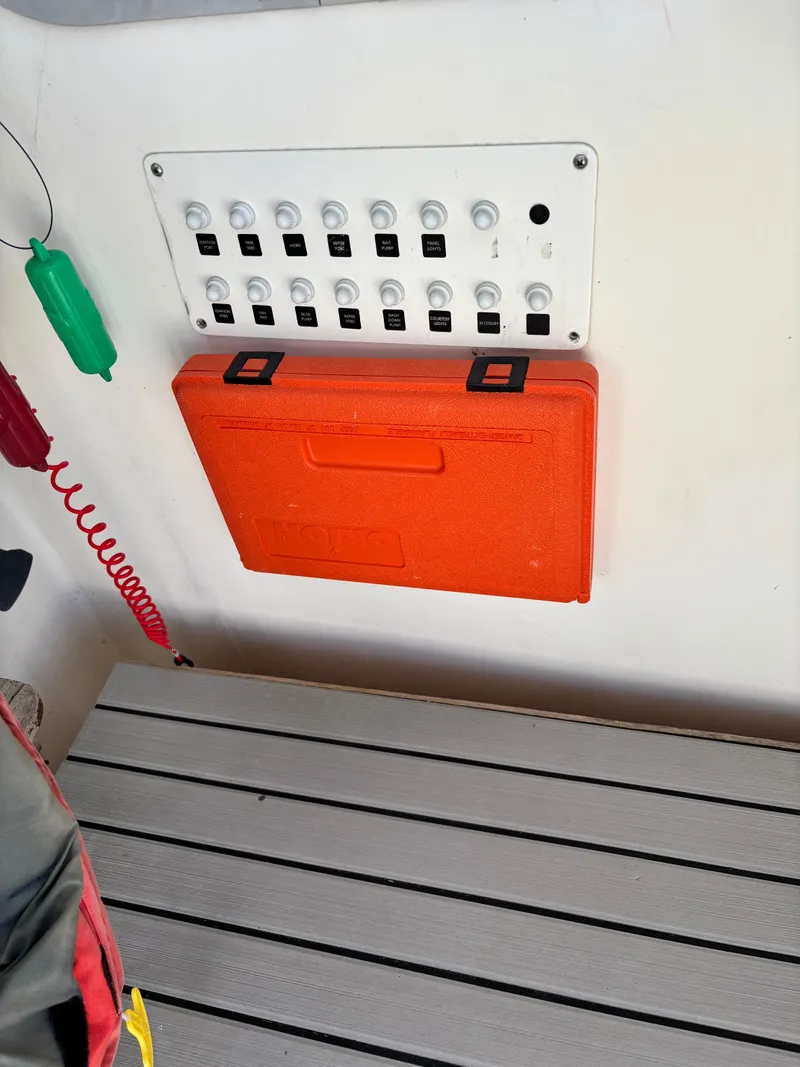 Slide: The Image of Control panel and orange case on 1992 Pursuit 2800 Open boat. - 8