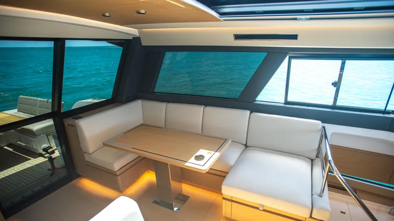 Slide: The Image of Luxurious interior of 2023 Pardo Yachts GT52 with ocean view and modern seating. - 19