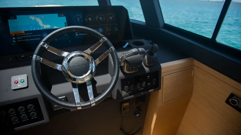 Slide: The Image of 2023 Pardo Yachts GT52 helm with modern controls and navigation display. - 21
