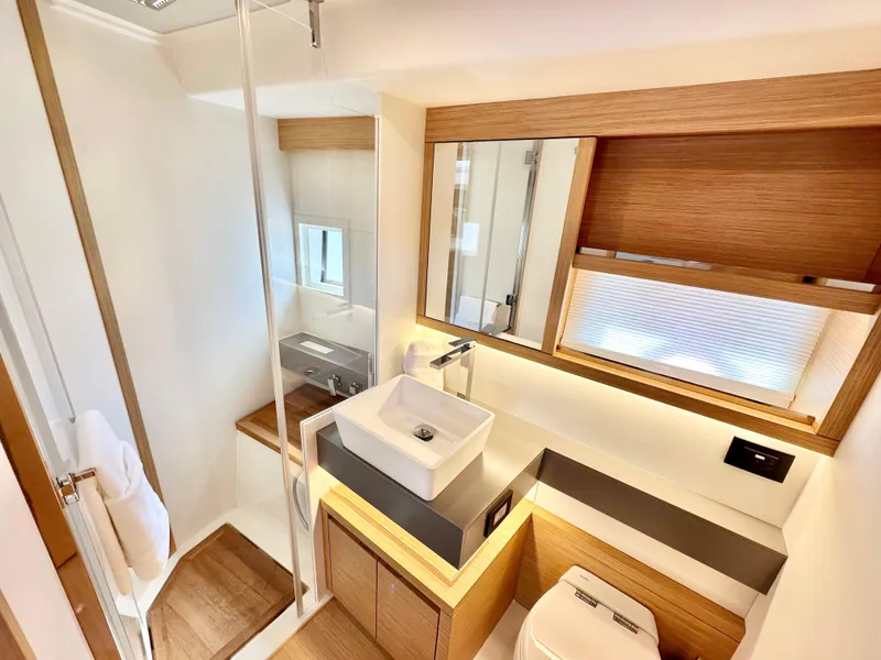 Slide: The Image of Luxurious bathroom interior of 2023 Pardo Yachts GT52, featuring modern fixtures and elegant wood accents. - 32