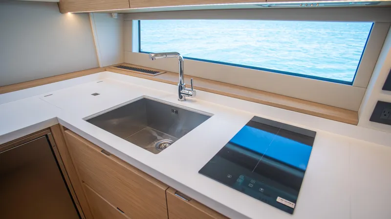 Slide: The Image of Modern kitchen in 2023 Pardo Yachts GT52 with sleek sink and cooktop. - 24