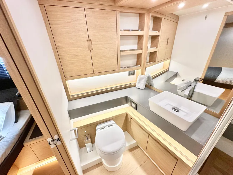 Slide: The Image of Luxurious bathroom interior of 2023 Pardo Yachts GT52 with modern fixtures and wooden cabinetry. - 28