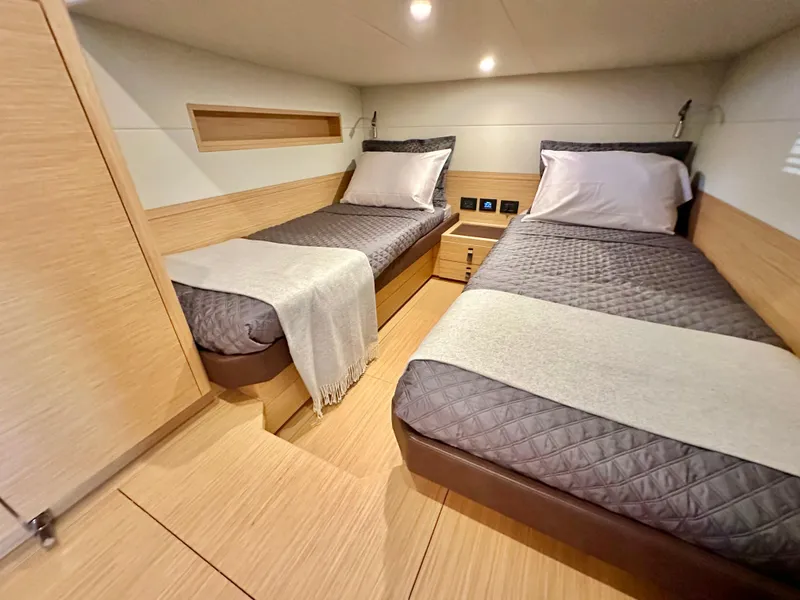 Slide: The Image of Luxurious twin cabin in 2023 Pardo Yachts GT52, featuring modern design and cozy bedding. - 30