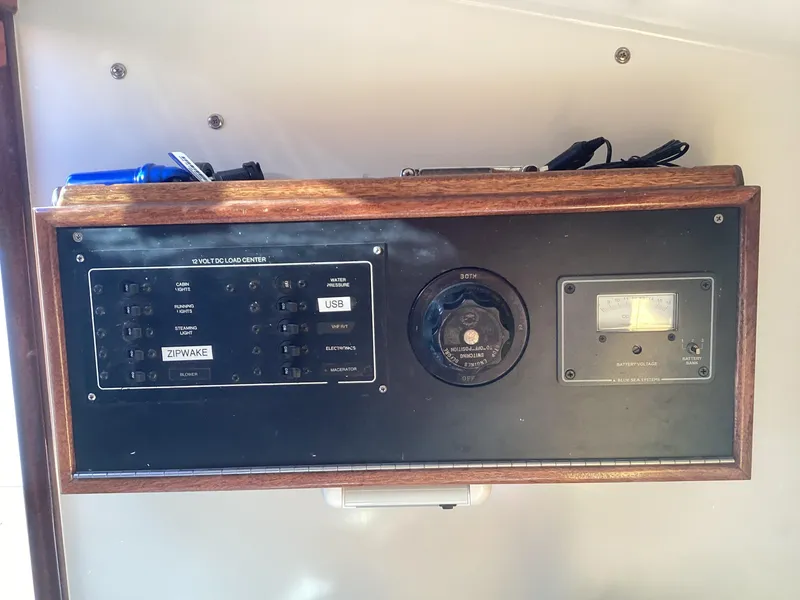 Slide: The Image of 2024 MacKenzie Cuttyhunk control panel with switches and USB port. - 14