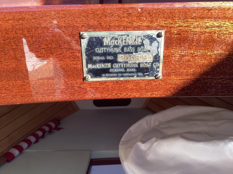 Slide: The Image of Plaque on 2024 MacKenzie Cuttyhunk boat, displaying serial number and manufacturer details. - 24