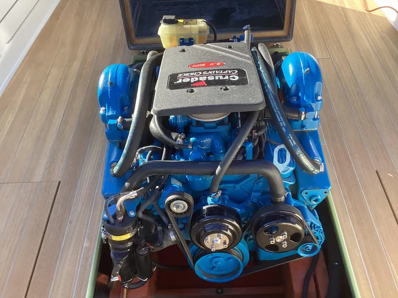 Slide: The Image of 2024 MacKenzie Cuttyhunk boat engine, Crusader Captain's Choice, blue and black components. - 26