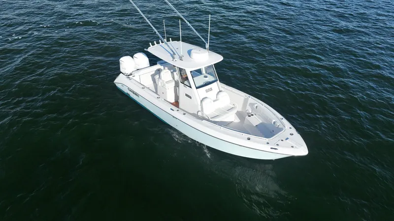 Slide: The Image of 2019 Everglades 295 Center Console boat on open water. - 12