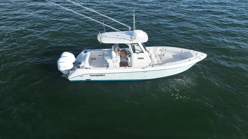 Slide: The Image of 2019 Everglades 295 Center Console boat on open water. - 13