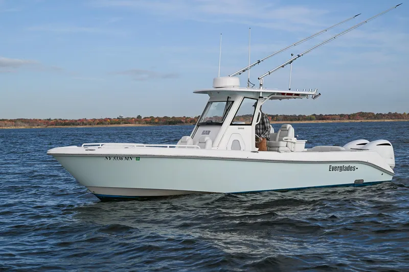 Slide: The Image of 2019 Everglades 295 Center Console boat on open water. - 17