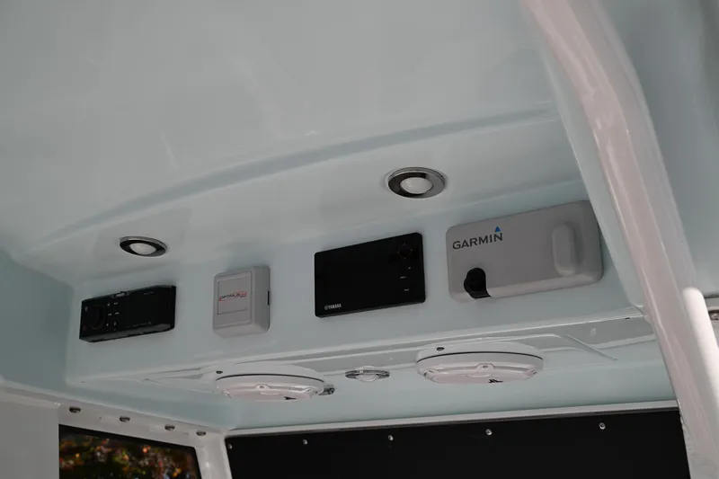 Slide: The Image of 2019 Everglades 295 Center Console boat electronics panel with Garmin equipment. - 31