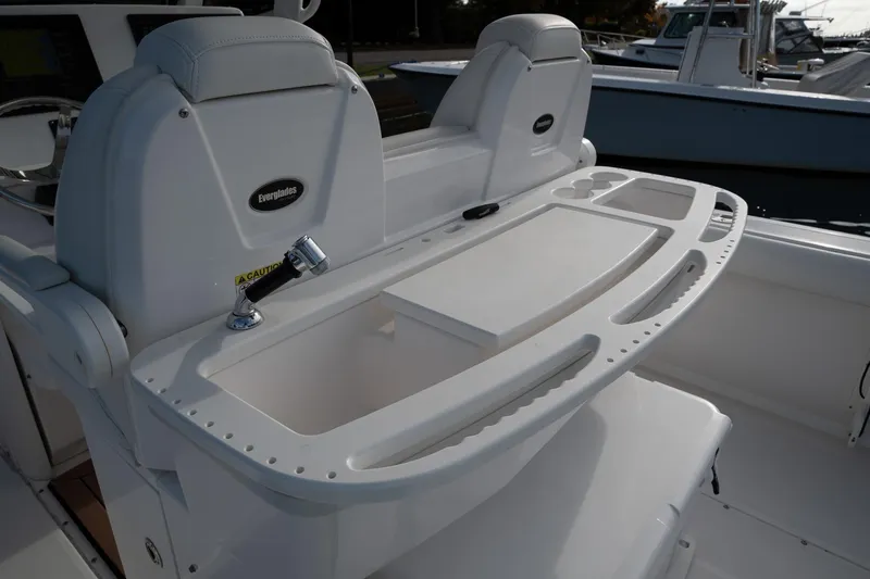 Slide: The Image of 2019 Everglades 295 Center Console boat with seating and storage area. - 34