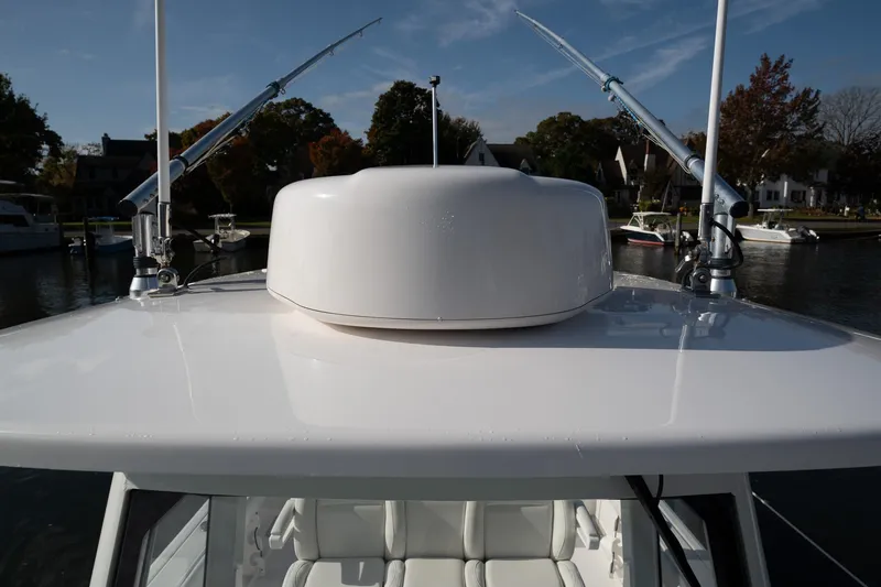 Slide: The Image of 2019 Everglades 295 Center Console boat with radar dome and antennas on top. - 44