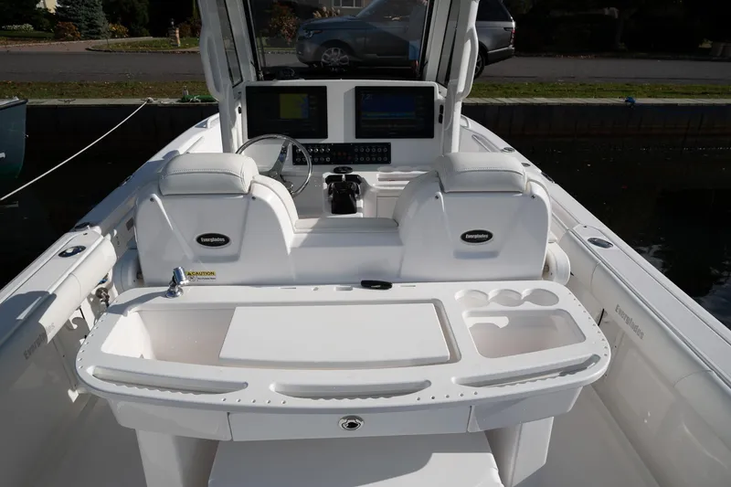 Slide: The Image of 2019 Everglades 295 Center Console boat interior with helm and seating. - 46