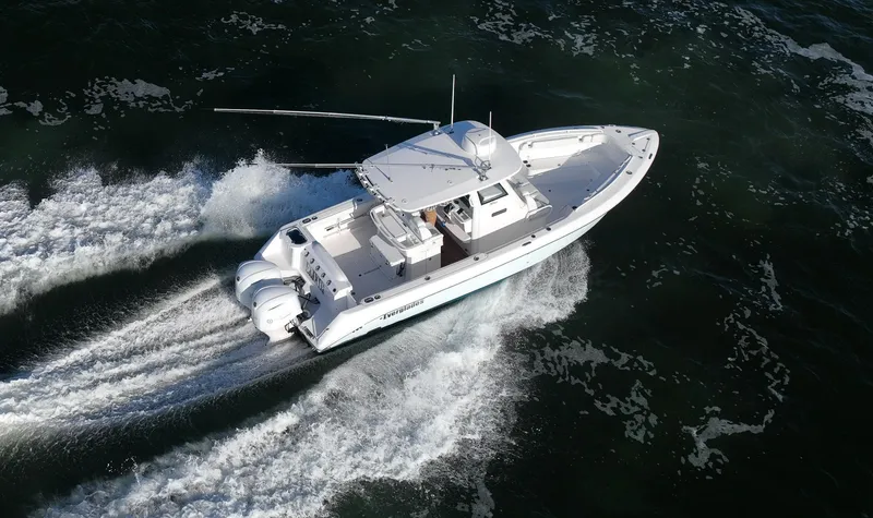Slide: The Image of 2019 Everglades 295 Center Console boat cruising on open water. - 7