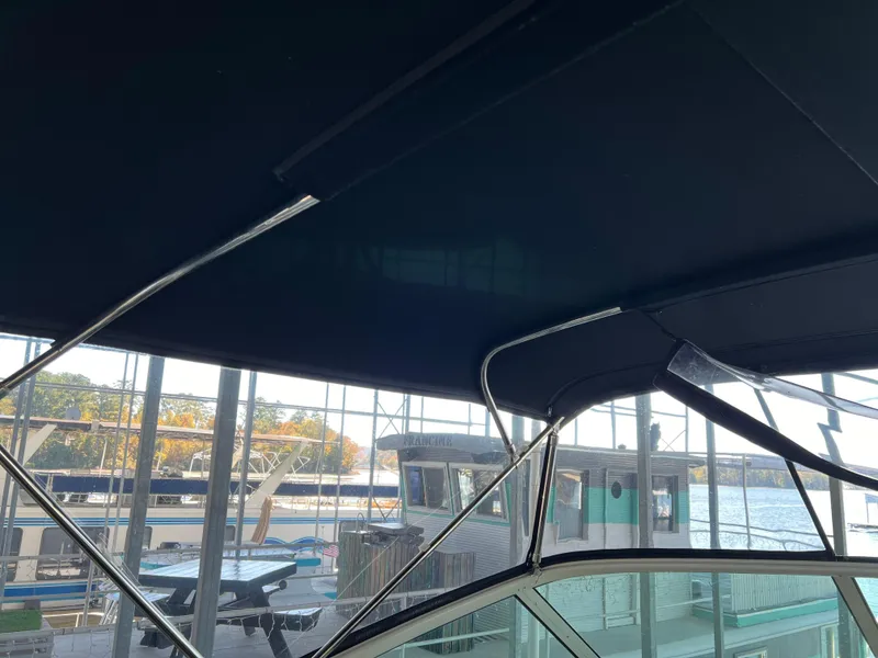 Slide: The Image of Interior view of 2001 Carver 450 Voyager Pilothouse with marina background. - 17