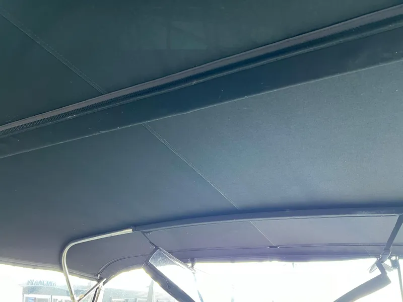 Slide: The Image of 2001 Carver 450 Voyager Pilothouse canopy detail with metal support structure. - 18