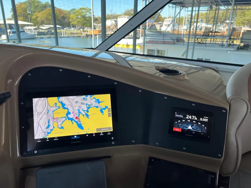 Slide: The Image of Carver 450 Voyager Pilothouse 2001 dashboard with navigation screens, docked at marina. - 19
