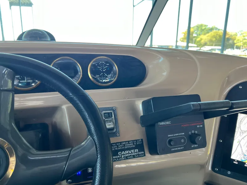 Slide: The Image of Interior view of 2001 Carver 450 Voyager Pilothouse dashboard with gauges and controls. - 20