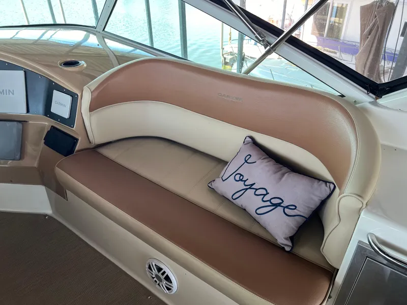 Slide: The Image of Carver 450 Voyager Pilothouse 2001 interior with cushioned seating and "Voyage" pillow. - 24