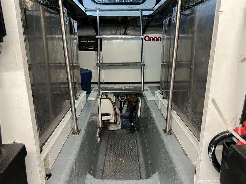 Slide: The Image of Engine room of 2001 Carver 450 Voyager Pilothouse with Onan generator. - 30