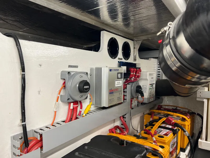 Slide: The Image of Engine room of 2001 Carver 450 Voyager Pilothouse with electrical components and wiring. - 31