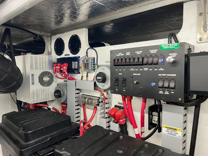 Slide: The Image of Engine room of 2001 Carver 450 Voyager Pilothouse with electrical panels and wiring. - 32
