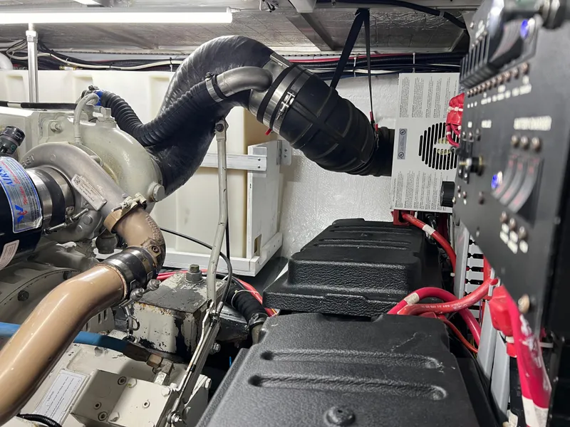 Slide: The Image of Engine room of 2001 Carver 450 Voyager Pilothouse with visible components and wiring. - 34