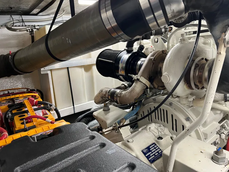 Slide: The Image of Engine room of 2001 Carver 450 Voyager Pilothouse with visible components and machinery. - 35