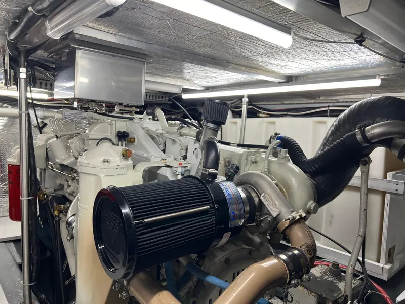 Slide: The Image of Engine room of 2001 Carver 450 Voyager Pilothouse with visible components and lighting. - 37