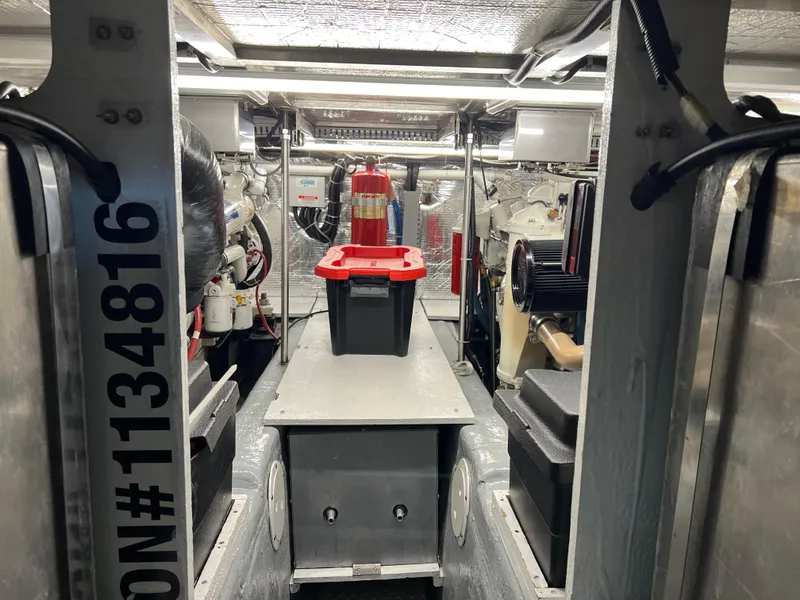 Slide: The Image of Engine room of 2001 Carver 450 Voyager Pilothouse with equipment and storage. - 38