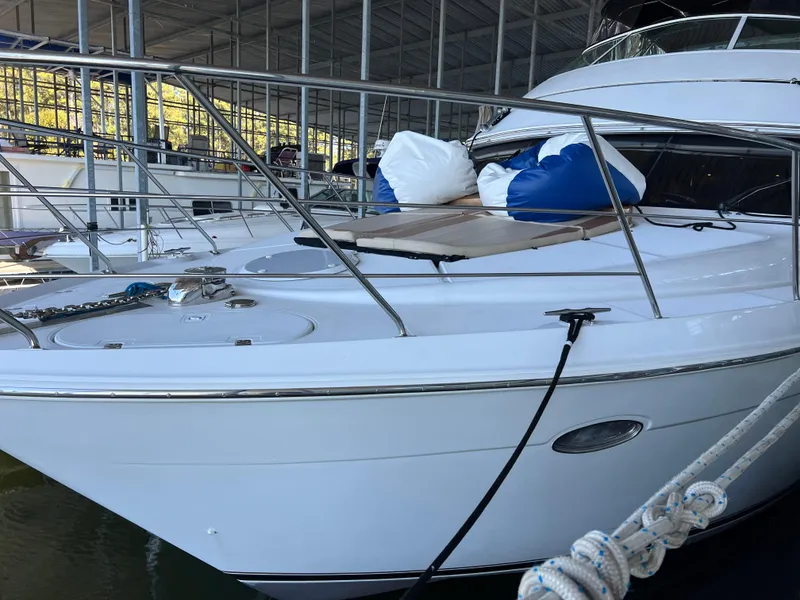 Slide: The Image of 2001 Carver 450 Voyager Pilothouse yacht docked in a marina. - 4