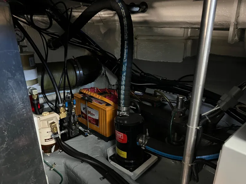 Slide: The Image of Engine room of 2001 Carver 450 Voyager Pilothouse with mechanical components and wiring. - 40