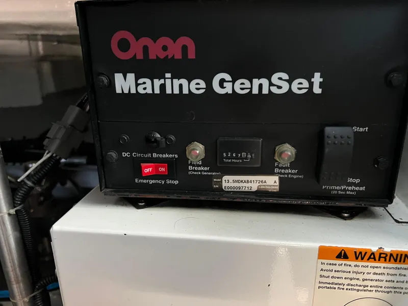 Slide: The Image of Onan Marine GenSet control panel on a 2001 Carver 450 Voyager Pilothouse. - 41