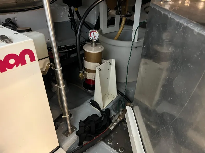 Slide: The Image of Engine room of 2001 Carver 450 Voyager Pilothouse with mechanical components. - 42