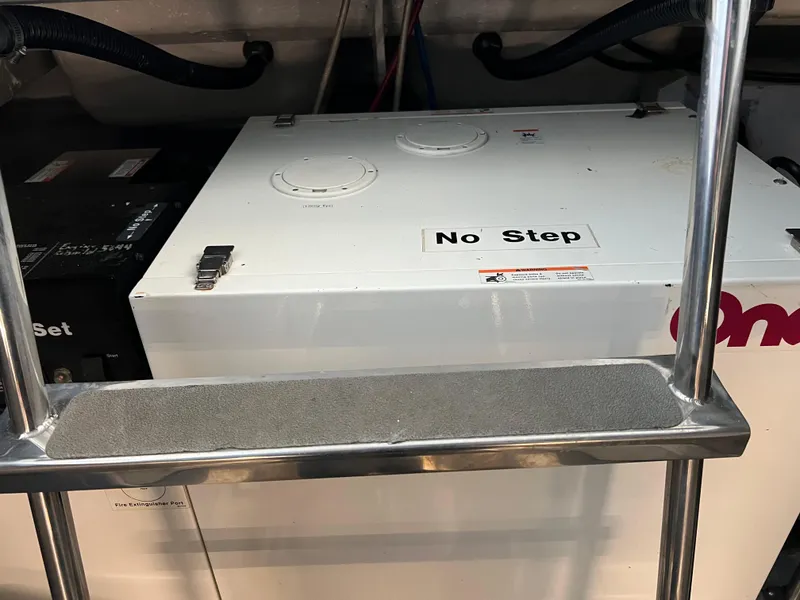 Slide: The Image of Engine room of 2001 Carver 450 Voyager Pilothouse with "No Step" warning sign. - 43