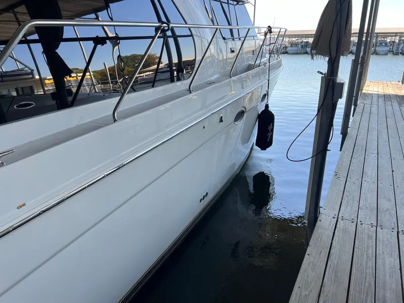 Slide: The Image of 2001 Carver 450 Voyager Pilothouse yacht docked at marina. - 5