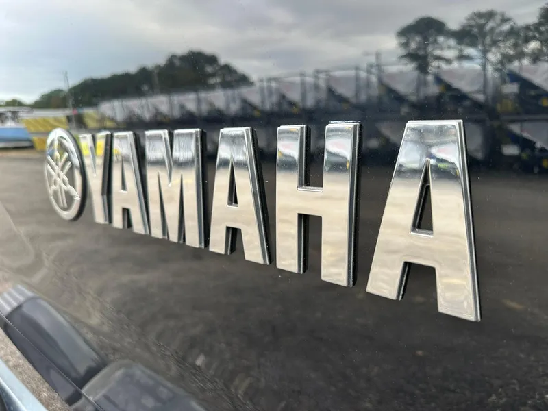 Slide: The Image of Close-up of 2025 Yamaha Boats AR220 logo on a reflective surface. - 12