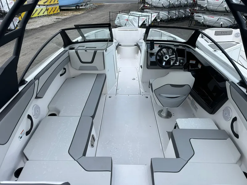 Slide: The Image of 2025 Yamaha Boats AR220 interior with sleek seating and modern dashboard design. - 14