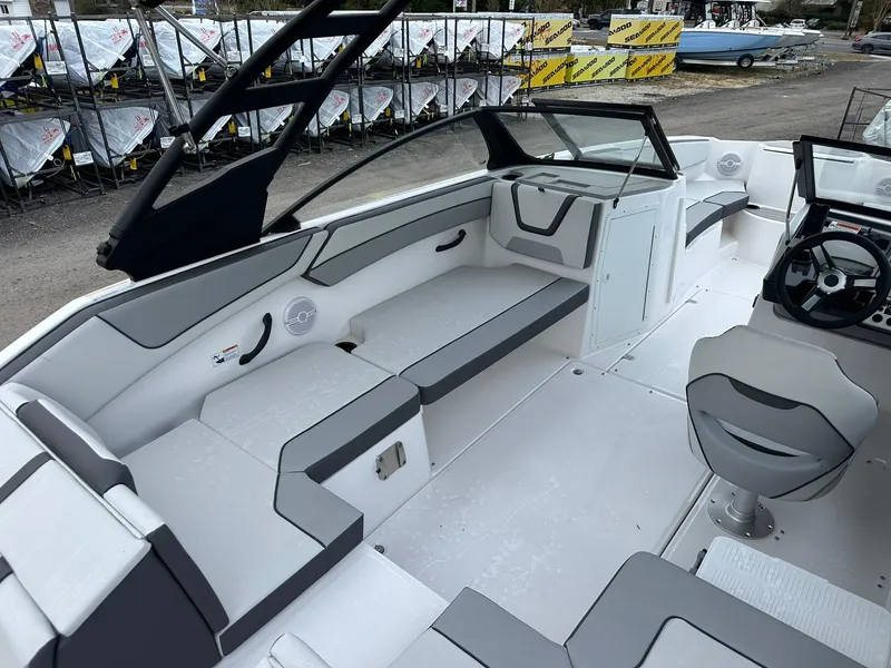 Slide: The Image of 2025 Yamaha Boats AR220 interior with sleek seating and modern dashboard design. - 15