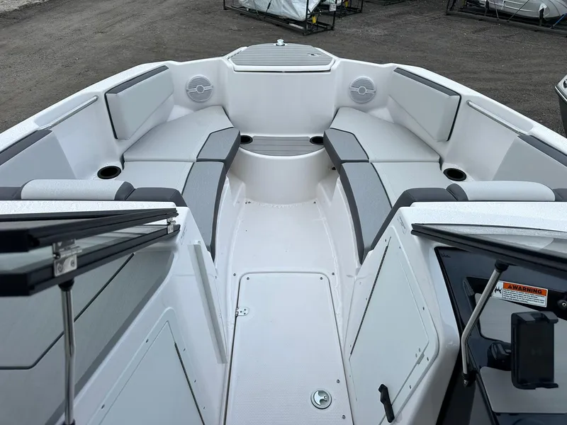 Slide: The Image of 2025 Yamaha Boats AR220 interior with sleek seating and modern design. - 18