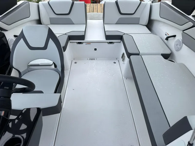 Slide: The Image of 2025 Yamaha Boats AR220 interior with modern seating and sleek design. - 21